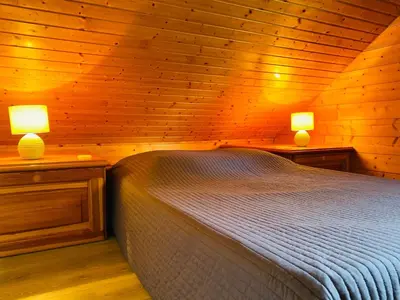 Un ou plusieurs lits dans un hébergement de l'établissement Chalet Gentiane
