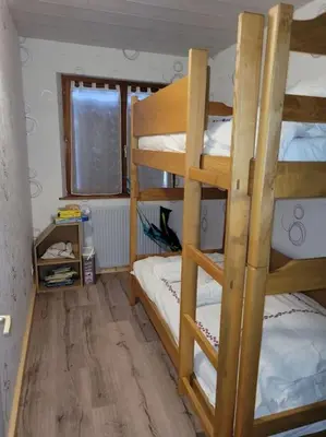 Un ou plusieurs lits dans un hébergement de l'établissement Gîte à la ferme du Lomont
