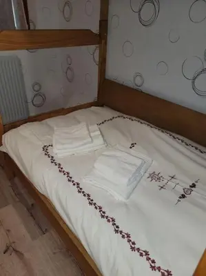 Un ou plusieurs lits dans un hébergement de l'établissement Gîte à la ferme du Lomont