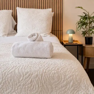 Un ou plusieurs lits dans un hébergement de l'établissement Studio 26 m2 à Mulhouse - Terrasse & Stationnement - Accès UHA & Tram