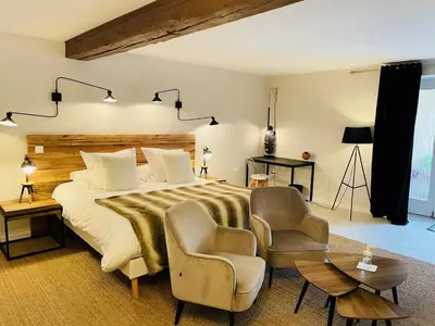 Un ou plusieurs lits dans un hébergement de l'établissement Zewwelatreppler - La Grange aux Petits Oignons - Chambre Cigogne