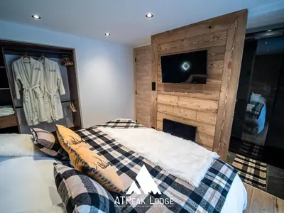 Un ou plusieurs lits dans un hébergement de l'établissement ATPeak Lodge Maison de Montagne d'exception