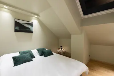 Un ou plusieurs lits dans un hébergement de l'établissement Mairnaige, luxueux appartement avec sauna