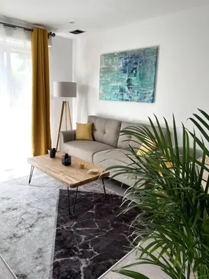 Coin salon dans l'établissement Superbe appartement lumineux avec parking gratuit