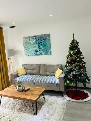 Coin salon dans l'établissement Superbe appartement lumineux avec parking gratuit