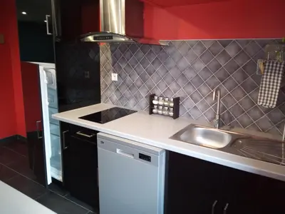 Cuisine ou kitchenette dans l'établissement Au Bercail