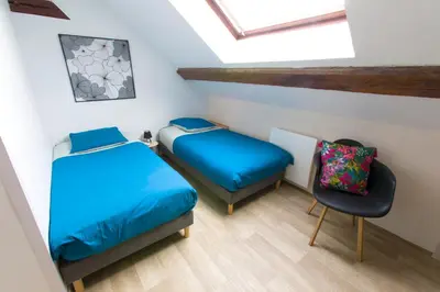 Un ou plusieurs lits dans un hébergement de l'établissement La couronne Maison 80m2 garage & terrasse