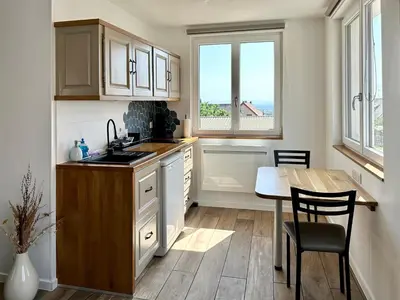Cuisine ou kitchenette dans l'établissement L’Escale
