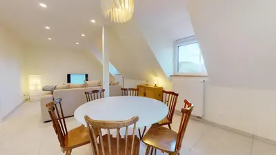 Coin salon dans l'établissement Appartements Le Tilleul de la Vallée Noble