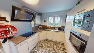 Cuisine ou kitchenette dans l'établissement Ô calme Maison familiale - Wickerschwihr
