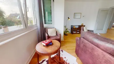 Coin salon dans l'établissement Appartement Le Passage - Ostheim