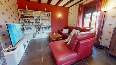 Télévision ou salle de divertissement dans l'établissement La maison Blanche - Issenheim