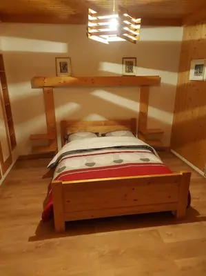 Un ou plusieurs lits dans un hébergement de l'établissement Bel appartement dans une ferme Vosgienne