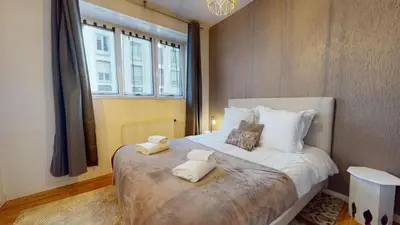Un ou plusieurs lits dans un hébergement de l'établissement Magic Home - Les Taillandiers