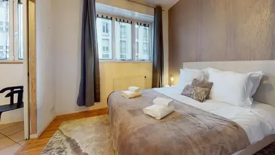 Un ou plusieurs lits dans un hébergement de l'établissement Magic Home - Les Taillandiers