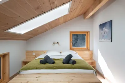 Un ou plusieurs lits dans un hébergement de l'établissement Chalet L'Urson, spacieux, jacuzzi, hammam et sauna