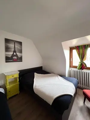Un ou plusieurs lits dans un hébergement de l'établissement L'Auberge SYRA - Gites Alsace - Proche EuropaPark