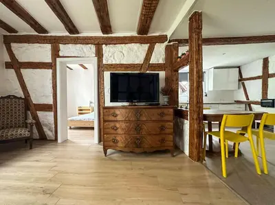 Télévision ou salle de divertissement dans l'établissement Le Colombage Heureux