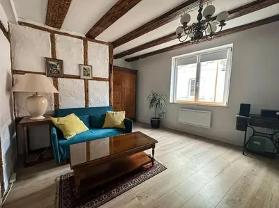 Coin salon dans l'établissement Le Colombage Heureux