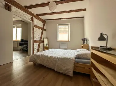 Un ou plusieurs lits dans un hébergement de l'établissement Le Colombage Heureux