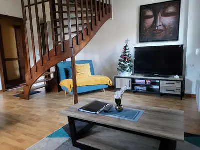 Télévision ou salle de divertissement dans l'établissement Beau duplex à proximité du lac de Gérardmer avec place de parking