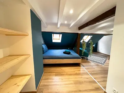 Un ou plusieurs lits dans un hébergement de l'établissement Au Duplex de Jeannala