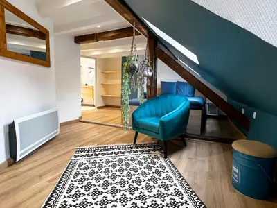 Coin salon dans l'établissement Au Duplex de Jeannala