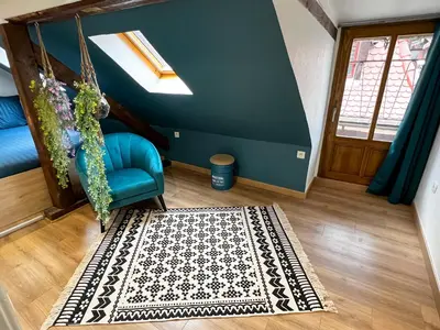 Coin salon dans l'établissement Au Duplex de Jeannala