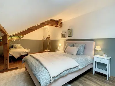 Un ou plusieurs lits dans un hébergement de l'établissement Aux Magnolias, Maison proche Colmar et Munster