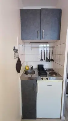 Cuisine ou kitchenette dans l'établissement Charmant Studio Proche Centre Ville + Parking