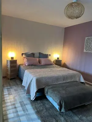 Un ou plusieurs lits dans un hébergement de l'établissement Gîte Les Lauriers