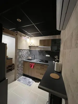 Cuisine ou kitchenette dans l'établissement Gîte Les Lauriers