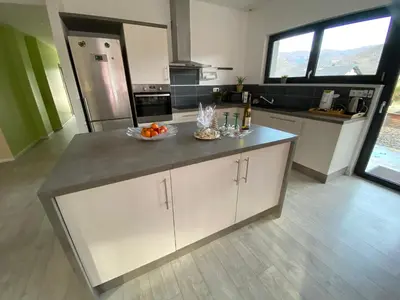 Cuisine ou kitchenette dans l'établissement Chez Nono