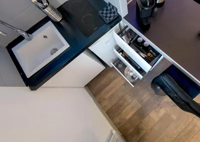 Cuisine ou kitchenette dans l'établissement Appart'Hôtel de la Gare - Cocooning