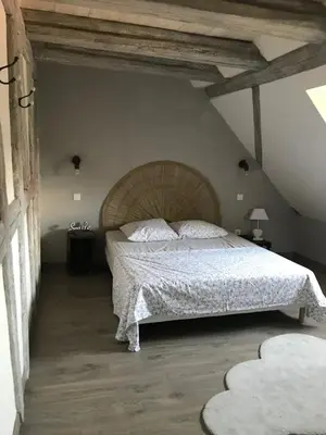 Un ou plusieurs lits dans un hébergement de l'établissement Le Logis du Vignoble