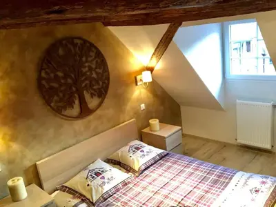 Un ou plusieurs lits dans un hébergement de l'établissement Le Logis du Vignoble