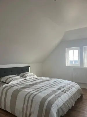 Un ou plusieurs lits dans un hébergement de l'établissement Duplex moderne à 10 minutes de Colmar