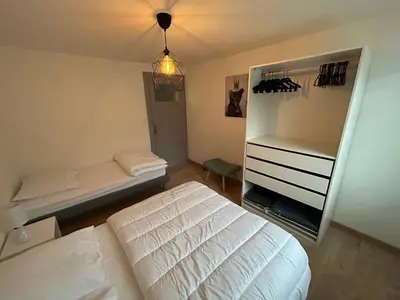 Un ou plusieurs lits dans un hébergement de l'établissement Appartement de Camargaux 70m2 secteur très calme