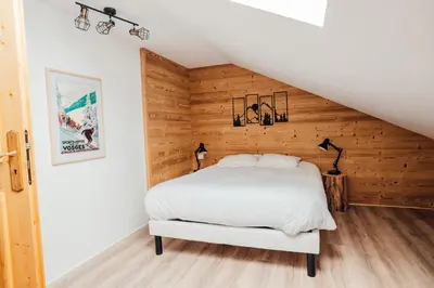 Un ou plusieurs lits dans un hébergement de l'établissement La maison du Xetté