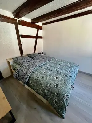 Un ou plusieurs lits dans un hébergement de l'établissement Appartement de charme alsacien, centre historique