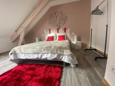 Un ou plusieurs lits dans un hébergement de l'établissement Le cosy de la vologne