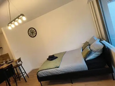 Un ou plusieurs lits dans un hébergement de l'établissement Charmant studio - Gare colmar