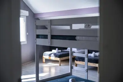 Un ou plusieurs lits dans un hébergement de l'établissement L'Écrin de Xattys - Gîte de luxe avec SPA et piscine privés, Terrain de pétanque, Baby-foot
