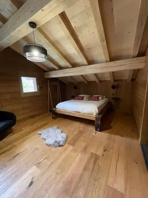 Un ou plusieurs lits dans un hébergement de l'établissement Chalet Neuf Au Chalet de Mel