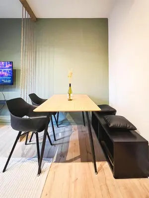 Télévision ou salle de divertissement dans l'établissement Appart'Hôtel Le Valdoie - Rénové, Calme & Netflix