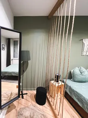 Un ou plusieurs lits dans un hébergement de l'établissement Appart'Hôtel Le Valdoie - Rénové, Calme & Netflix