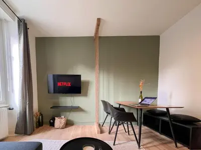 Télévision ou salle de divertissement dans l'établissement Appart'Hôtel Le Valdoie - Rénové, Calme & Netflix