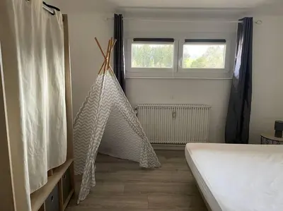 Un ou plusieurs lits dans un hébergement de l'établissement Loft avec jardin