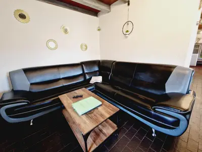 Coin salon dans l'établissement Gitedaval Le Petit Hangy