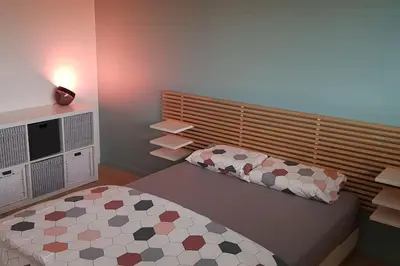 Un ou plusieurs lits dans un hébergement de l'établissement Maison Passive avec piscine proche Colmar